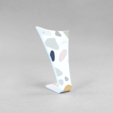 Fin shaped display with terrazzo effect finish to hold 1 pair of earrings.